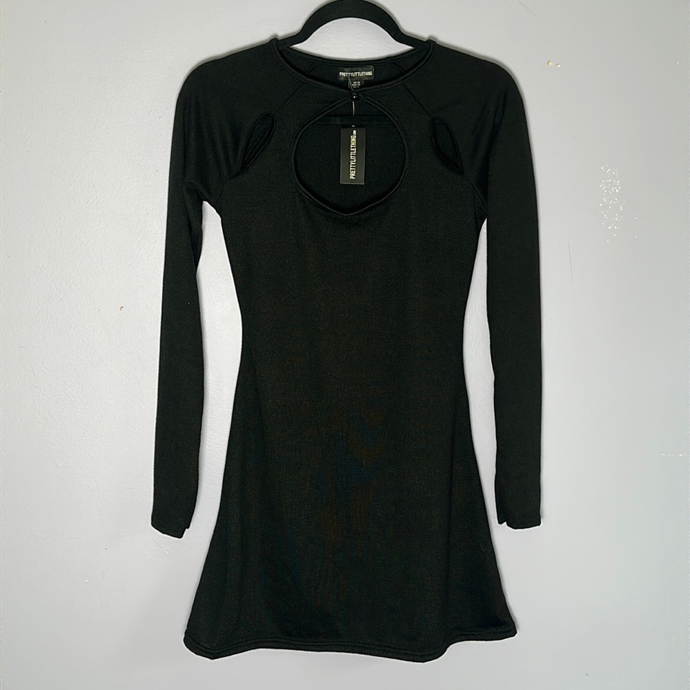 Black jersey cut out bodycon with flared bottom long sleeve mini dress